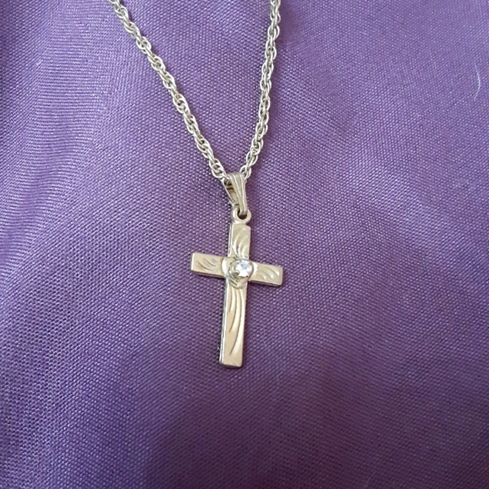Cross necklace with faux diamond in  center of the cross